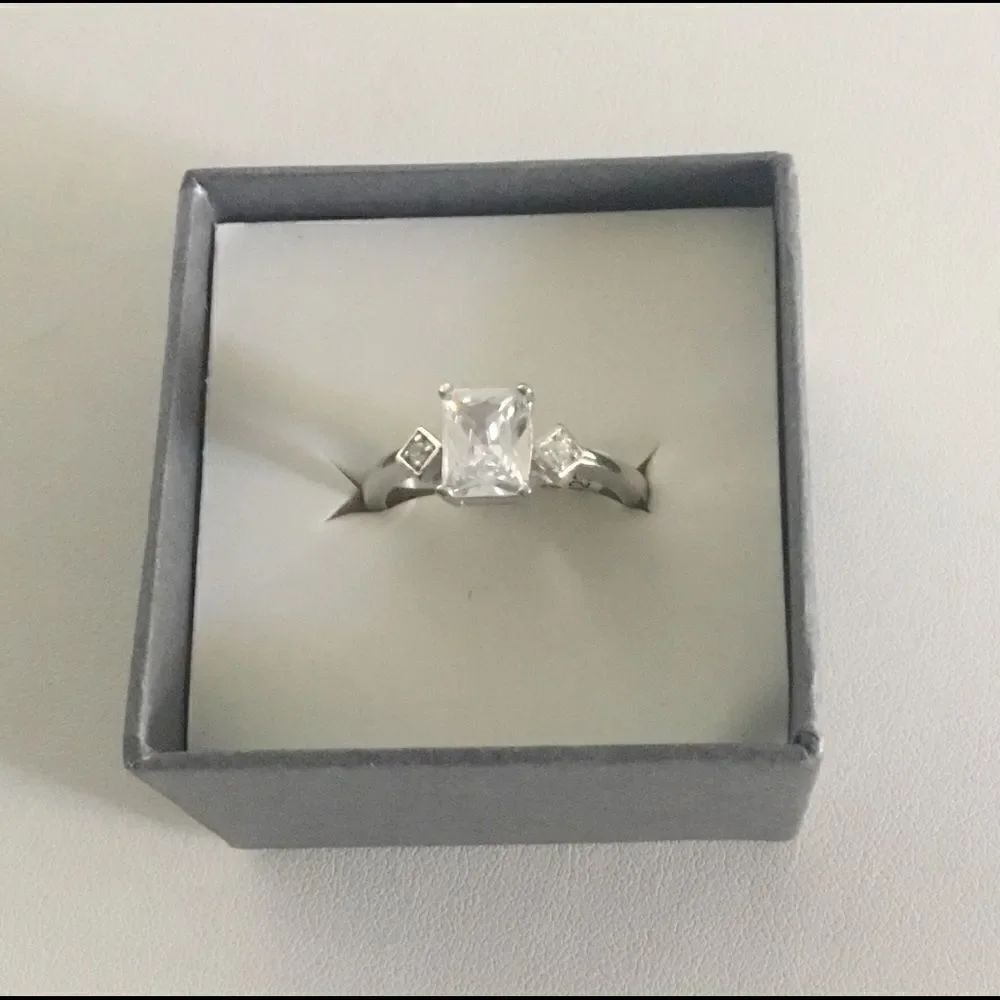1.8 Ct. Emerald Cut Simulated Diamond Bridal Ring
